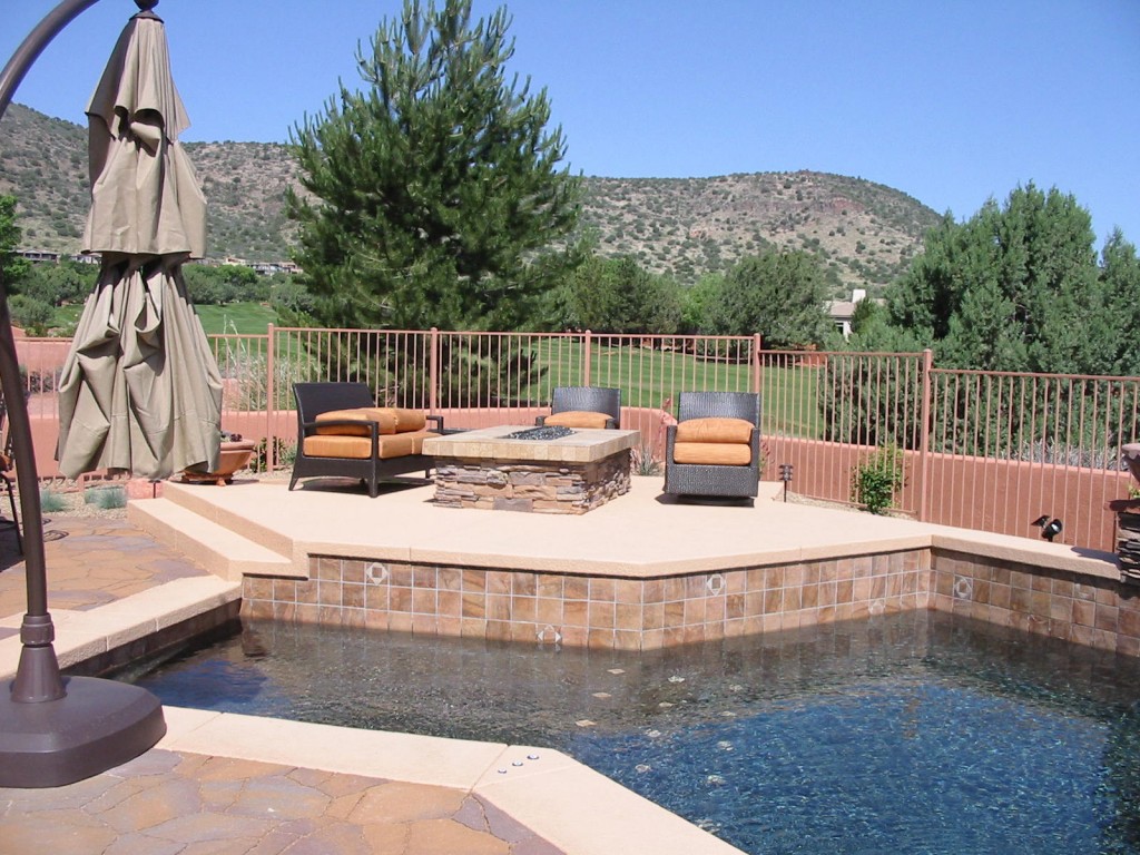 Fire pit and pool designed by JSL Landscape and built by Waterline International